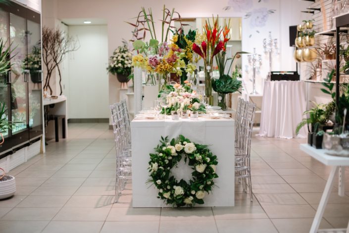 Calyx Floral Design Grand Opening front entrance with tropical flowers and wreath