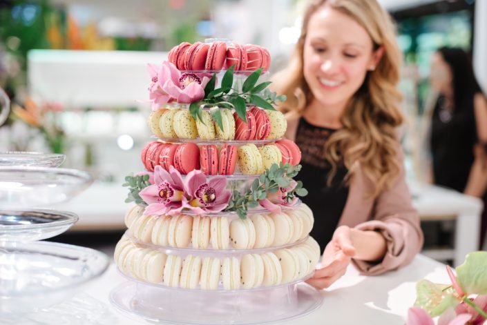 Este of Stella bean sweets with macaron tower and cymbidium orchids and eucalytpus at Calyx Floral Design Grand Opening