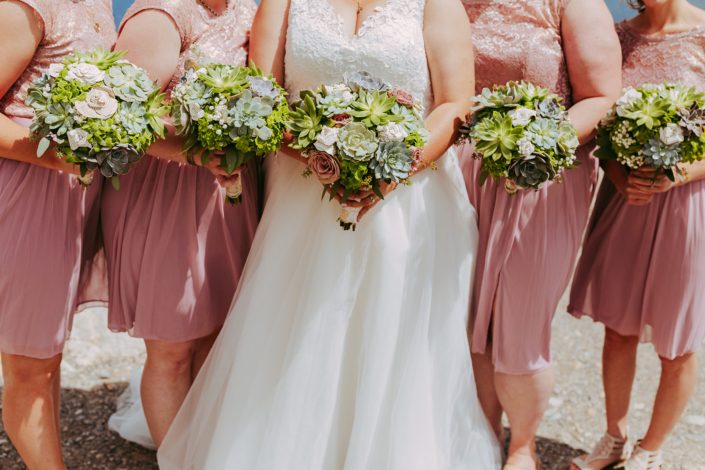 Bride and bridesmaids in blush with bridal boquuets designed with succulents, roses, echivaria and paper flowers
