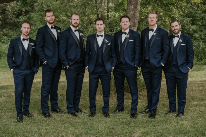 Groom and Groomsmen in navy Tuxedo with spray rose boutonnieres