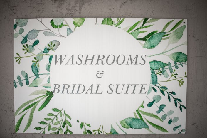 sign for washrooms and bridal suite at hilltop wedding center