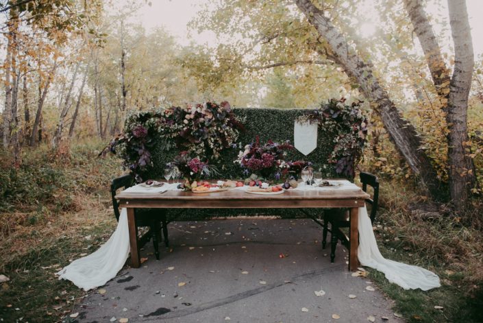 Mckenzie trails in Red Deer autumn harvest styled shoot with harvest table and chacuterie boards and burgundy floral accents