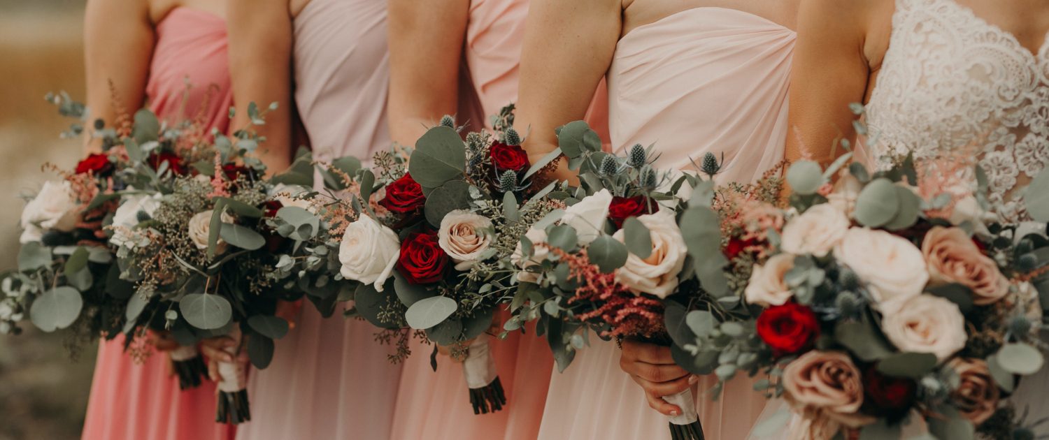Blush and Red and White Wedding bridal party with ombre blush dresses and bouquets with red roses and white o'hara garden roses and pink astilbe and quicksand roses and navy eryngium and mixed eucalyptus