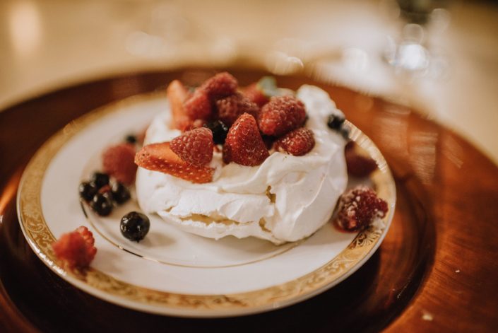 Delicious meringue dessert with strawberries and blueberries
