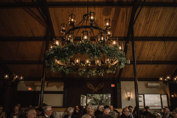 chandelier at Canyon skir resort decorated for a wedding with fresh mixed eucalyptus greenery garland