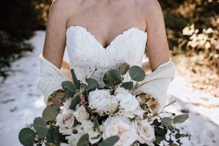 white bridal bouquet with roses garden roses and eucalyptus