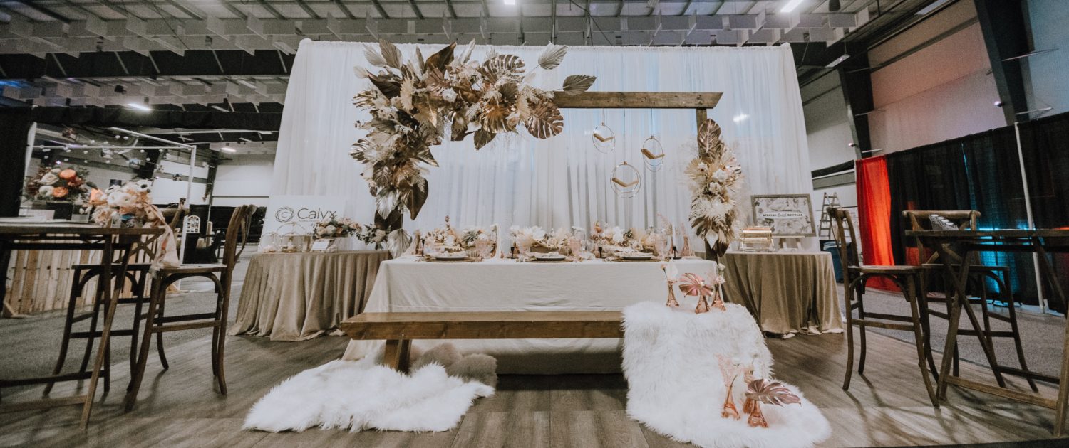 With This Ring Bridal Gala 2020 booth with wood, metallic, white, cream, ivory, and blush pink accents