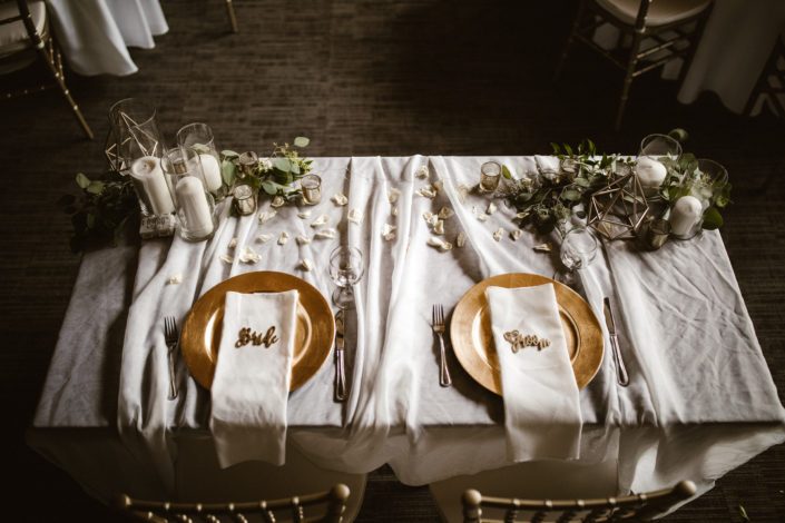 Bride and groom's sweetheart tablescape with accents of gold.