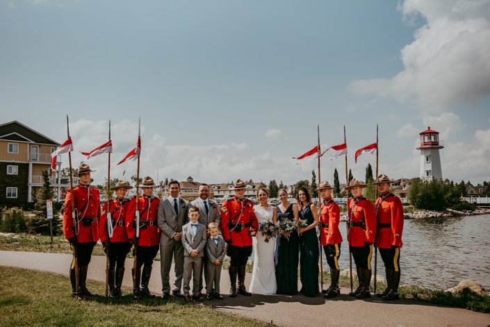 Tanya and Sean's RCMP Wedding bridal party by the Sylvan Lake lighthouse