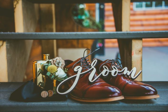 Groom's shoes, boutonniere, cologne