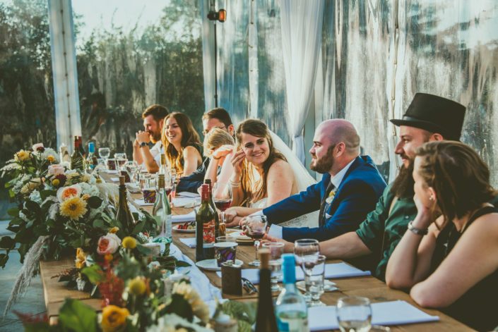 Head table at Bianca and Matt's mustard yellow pine and pond wedding.