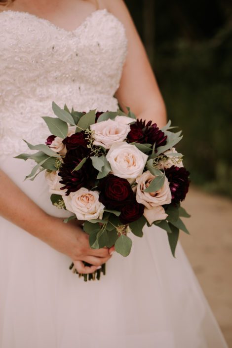 Tamara's Rustic Chic Burgundy and Blush Bridal Bouquet featuring burgundy dahlias, White O'hara Garden roses, Black Baccara roses, quicksand roses and seeded eucalyptus.