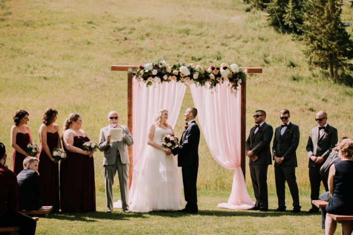 Tamara and Kyle's Rustic Chic Burgundy and Blush outdoor ceremony with bridal bouquet, bridesmaids bouquets, archway arrangement and boutonnieres.
