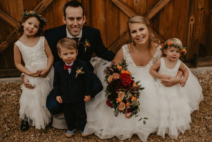 Bride and groom, Hayley and James, rustic fall wedding flower girls and ring bearer with flower crowns and boutonniere.