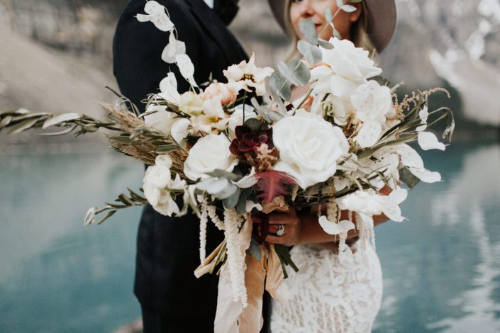 Rocky Mountain Elopement Styled Shoot - boho bouquet designed with eucalyptus, olive branches, pampas grass, roses, succulents, ranunculus, sweet pea, amaranth, lysianthus, succulents