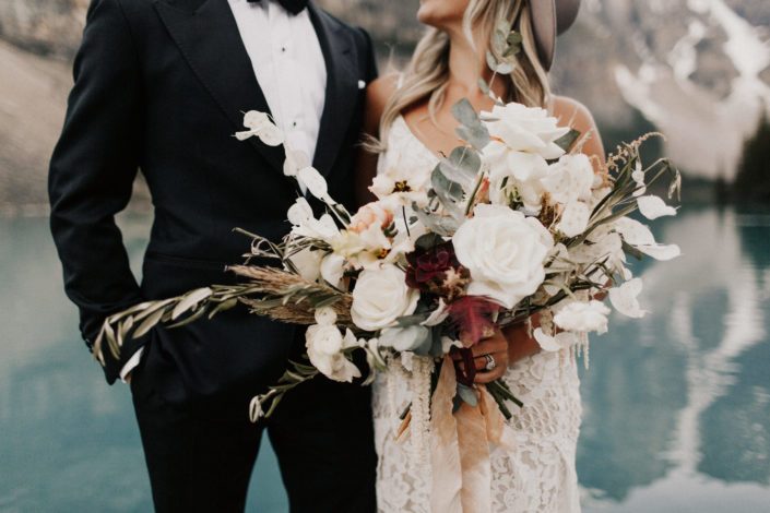 Boho bridal bouquet designed with olive branches, pampas grass, olive branches, sweet peas, lysianthus, roses, ranunculus, amaranthus, astilbe, succulents