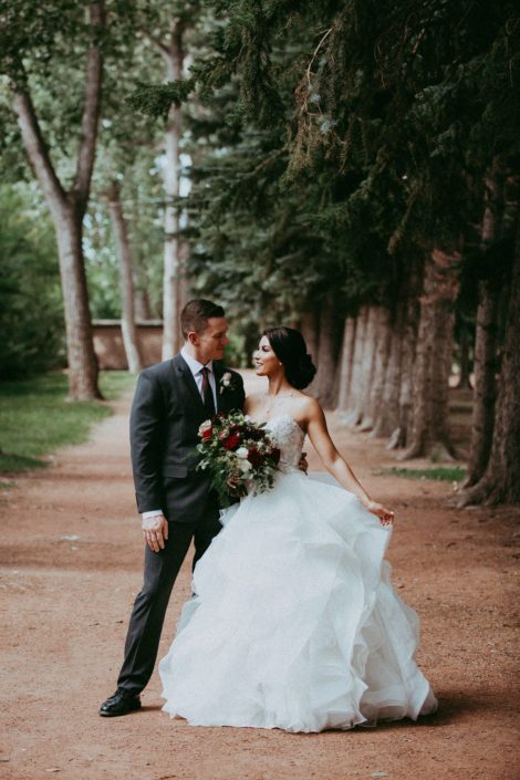 Bride and Groom; Cinderella gown and grey suit; burgundy and dark grey wedding; bridal bouquet designed with hearts garden roses, burgundy dahlias, amnesia roses and black pearl lisianthus