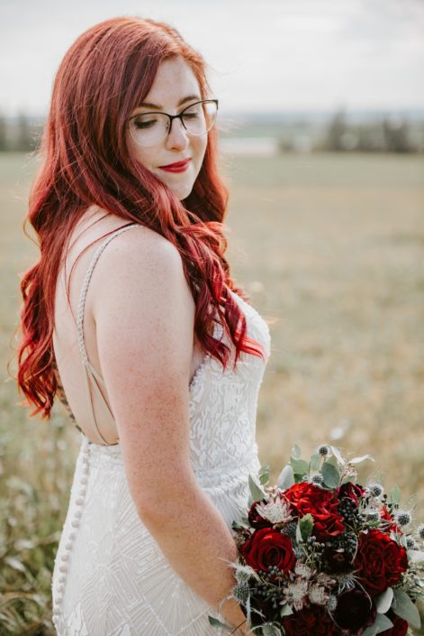 Hailey and Brandon's Burgundy and Royal Blue Wedding - Bride, Hailey, with burgundy and blue bridal bouquet