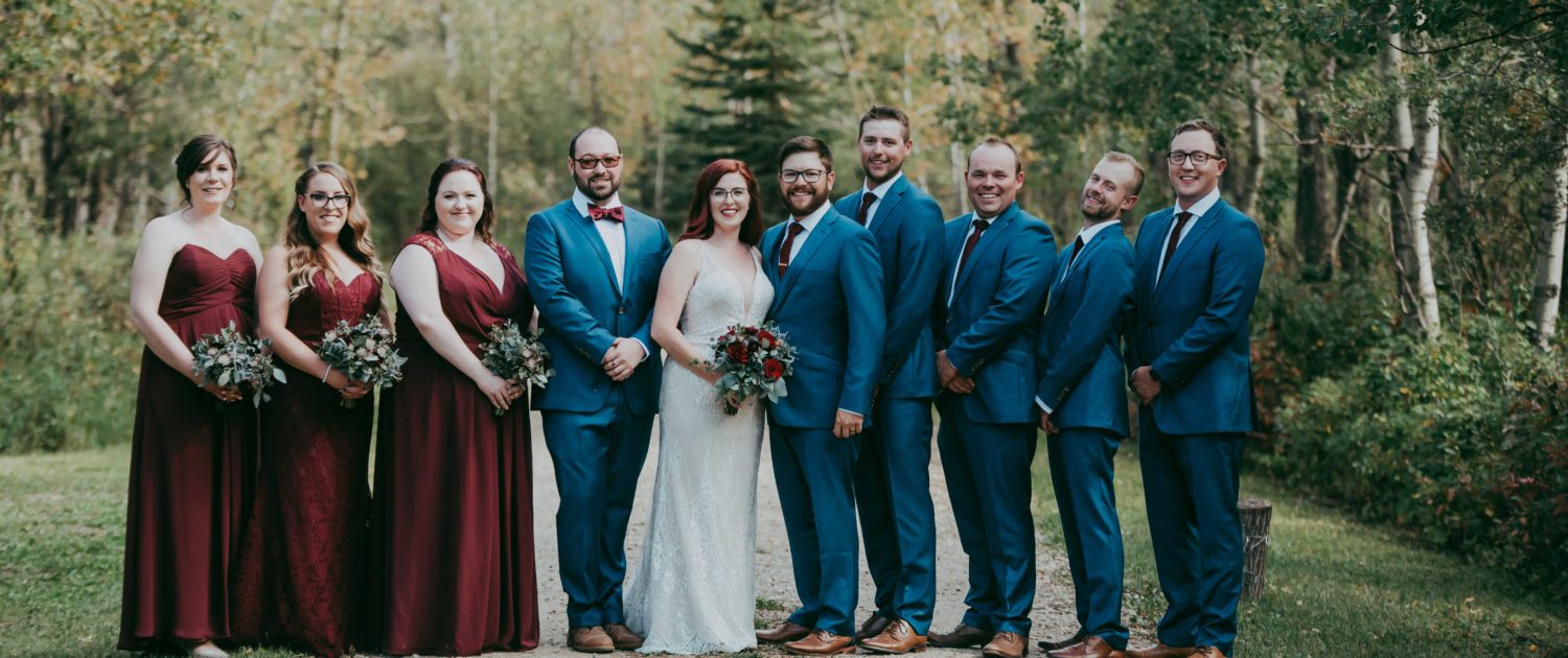 Burgundy and royal blue wedding party with burgundy bouquets
