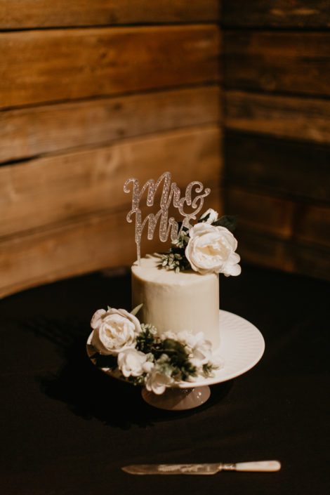 White wedding cake decorated with white flowers