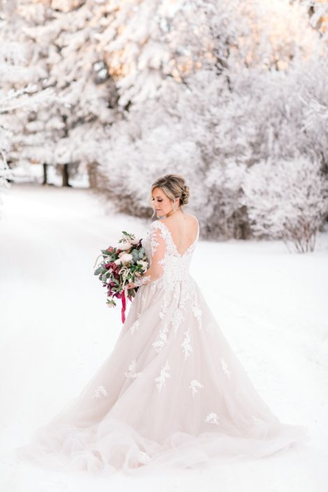 Blush and burgundy bouquet in a snow covered winter wonderland