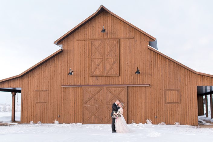 Bride and groom in front of Sweet Haven Barn