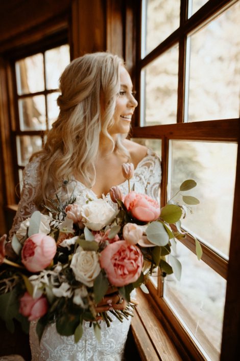 Bridal bouquet designed with peonies, roses, tulips, eryngium and eucalyptus