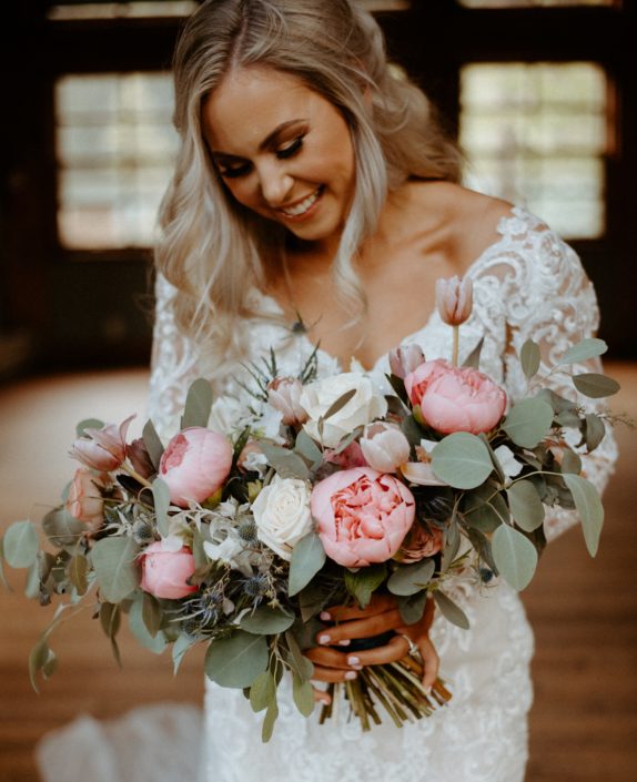 Emerald Lake Photoshoot bridal bouquet designed with pink peonies, roses, tulips, eryngium, and eucalyptus