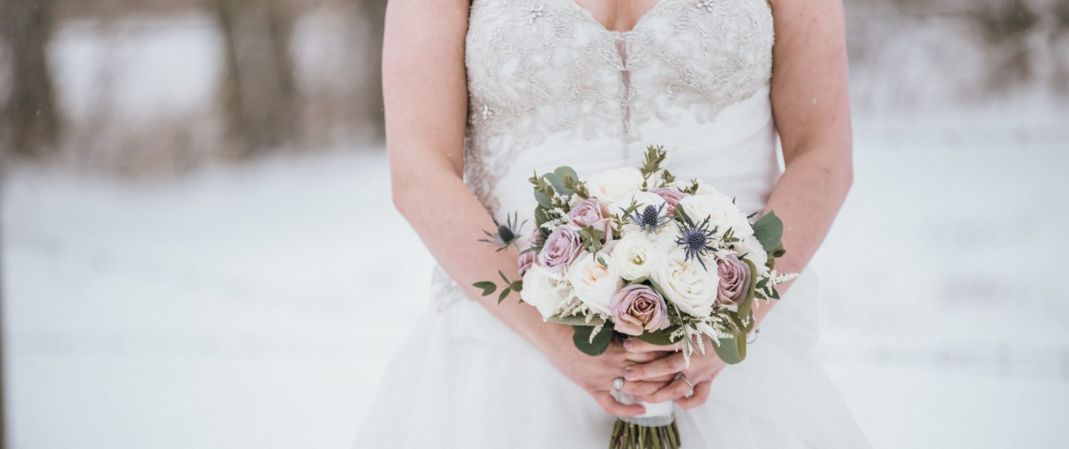 Erin's mauve and navy winter wedding bridal bouquet designed with astilbe, eryngium, white o'hara garden roses, ranunculus, amnesia roses, playa blanca roses and eucalyptus