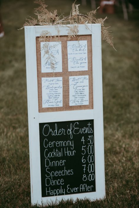 Wedding sign decorated with gold plumosa