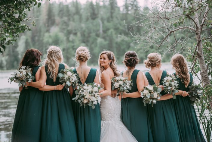 Natural white and green wedding; Bridesmaids wearing green dresses and bride with white and green bouquets
