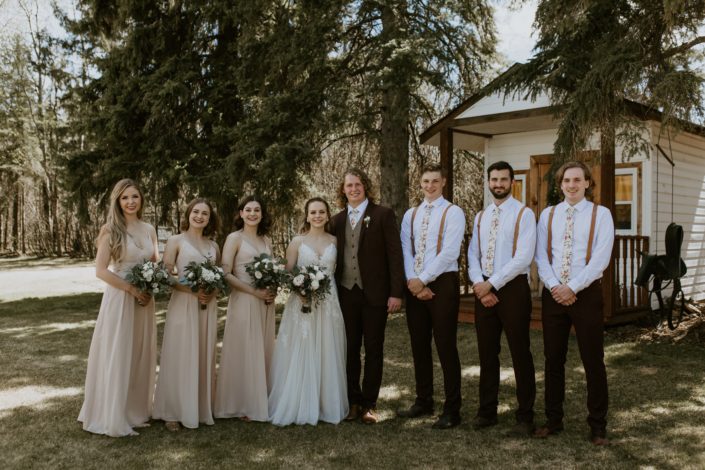 Rustic Elegance Bridal Party; bridesmaids wearing blush, groomsmen wearing suspenders; bouquets designed with blush, white & burgundy flowers
