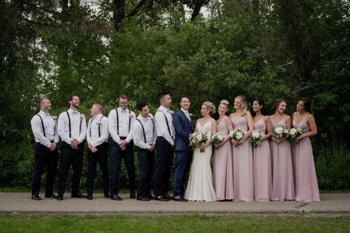 Burgundy and Mauve Bridal party with bouquets and boutonnieres