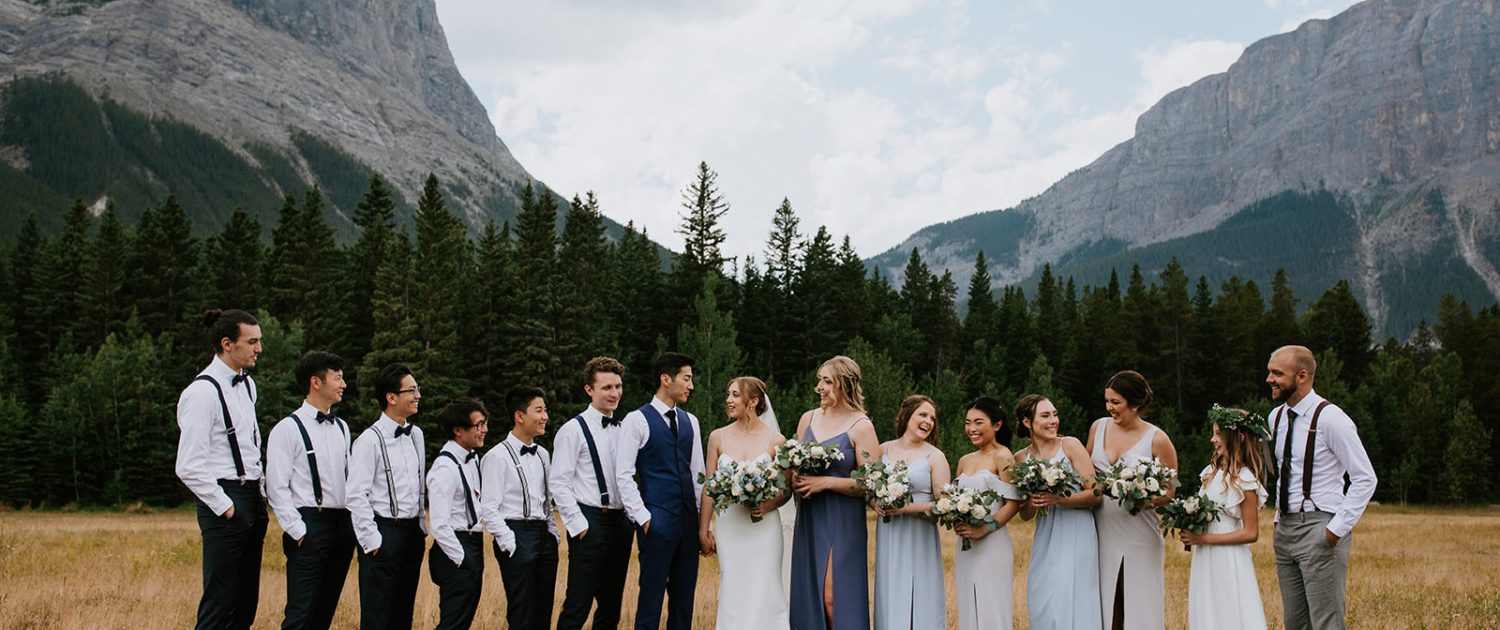 White and blue Canmore Wedding bridal party with bridal bouquet, bridesmaids bouquets, boutonnieres designed with white and blue flowers