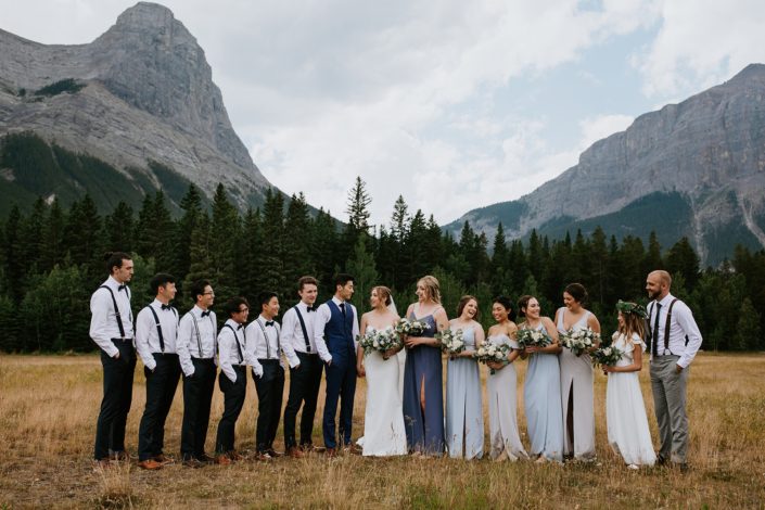 White and blue Canmore Wedding bridal party with bridal bouquet, bridesmaids bouquets, boutonnieres designed with white and blue flowers