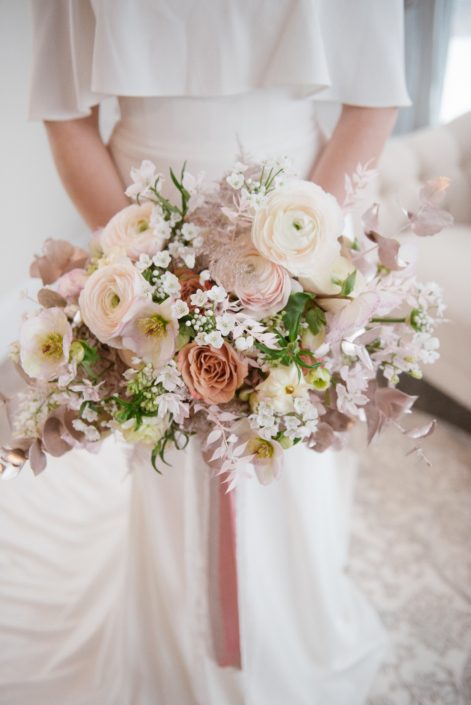Blush pink, white and rose gold bridal bouquet; ranunculus, roses, hellebores, alyssum, cosmos, bleached italian ruscus, plumosa, rose gold painted eucalyptus