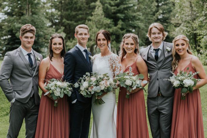 Rusty Rose Wedding bridal party with bouquets and boutonnieres