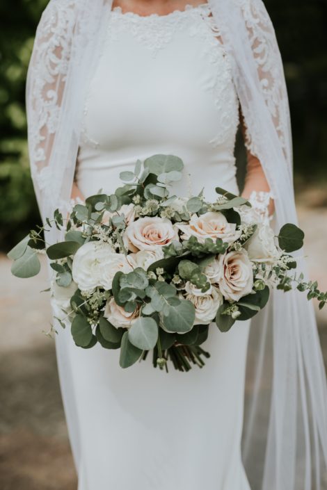 Rusty Rose Wedding bridal bouquet designed with cappuccino roses, playa blanca roses, astilbe, astrantia, ranunculus and spray roses with a mixed variety of eucalyptus greenery