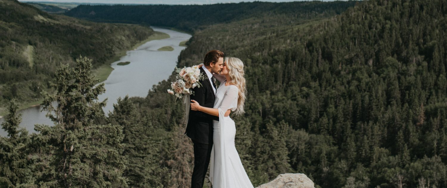 Bride and groom kissing in the Valley