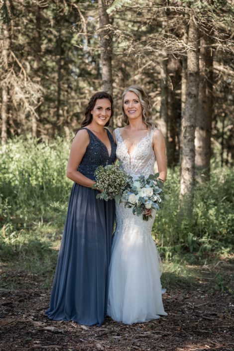 Bride and bridesmaid with bouquets
