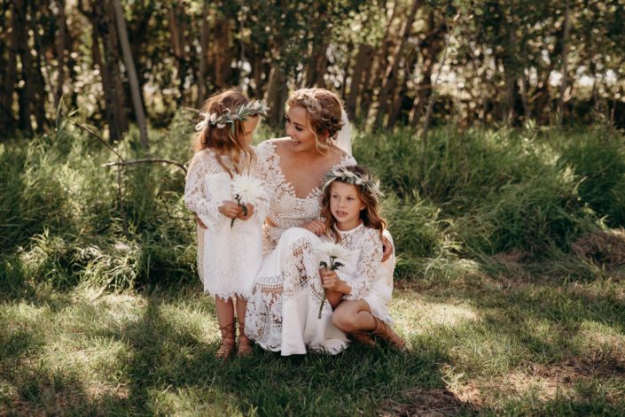 Bride with flower girls wearing flower crowns made of eucalyptus, bleached bracken fern, bunny tail and pampas grass