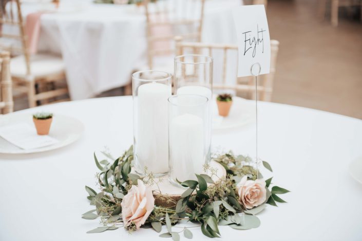 wedding centerpiece with eucalyptus and roses