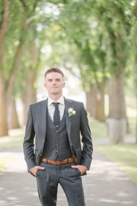 charming groom with boutonnier