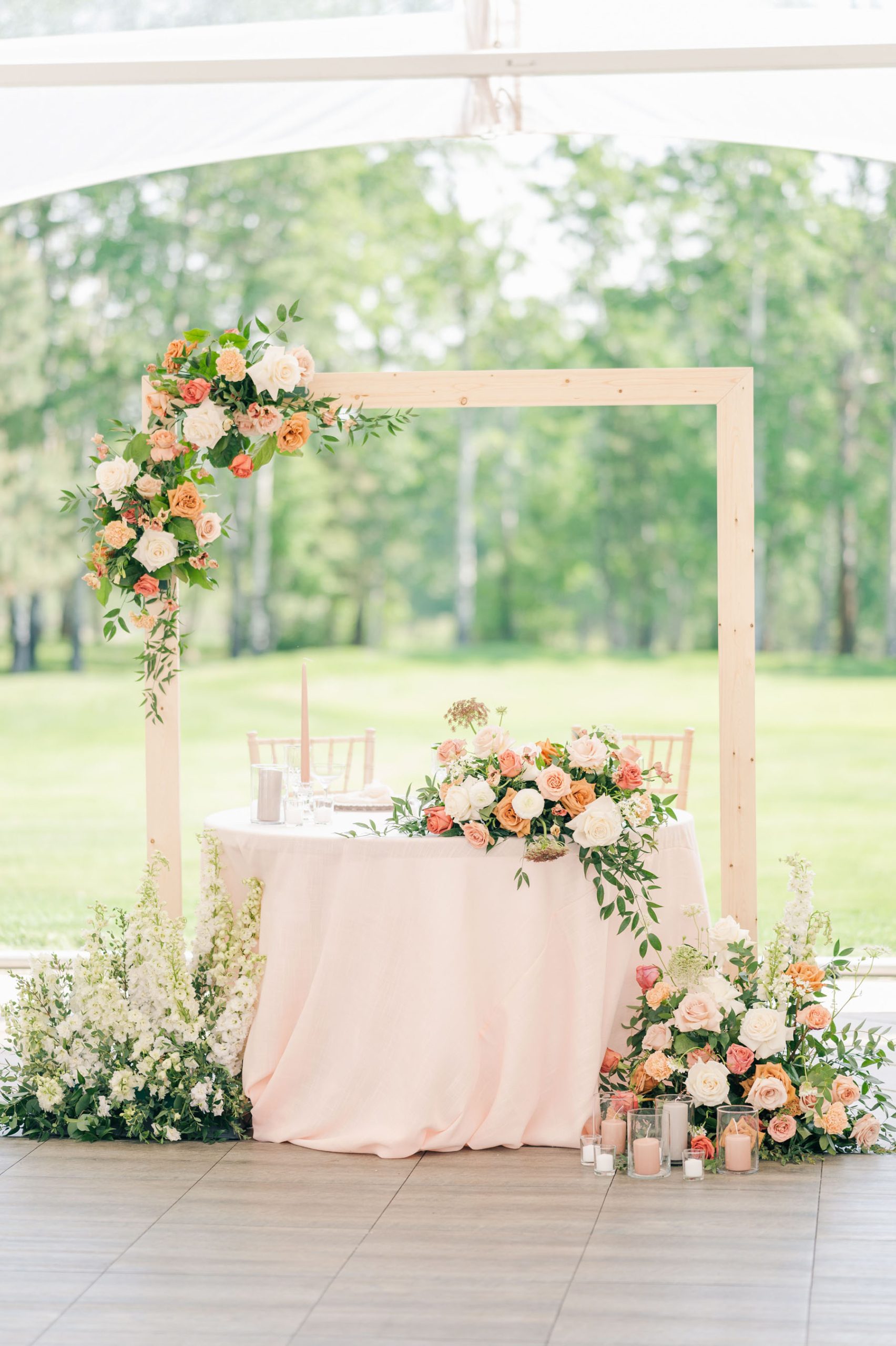 Wedding signing table with pastel and greenery floral installations