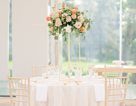 Large tall blush and peach centerpiece at an event