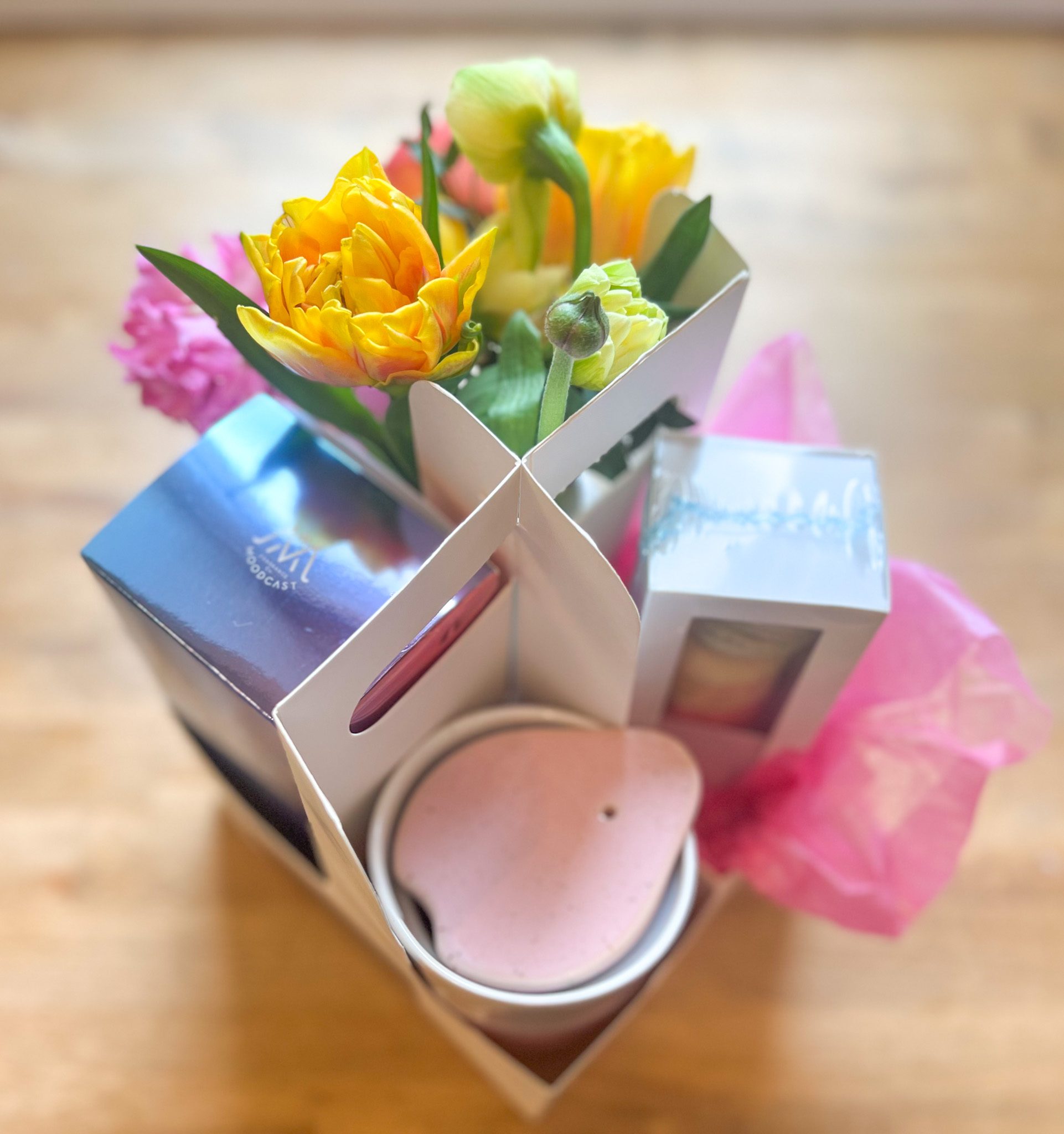 The perfect gift for Mom! A chic travel mug, sweet reed diffuser, vibrant flowers and treats from Queen Bee's.