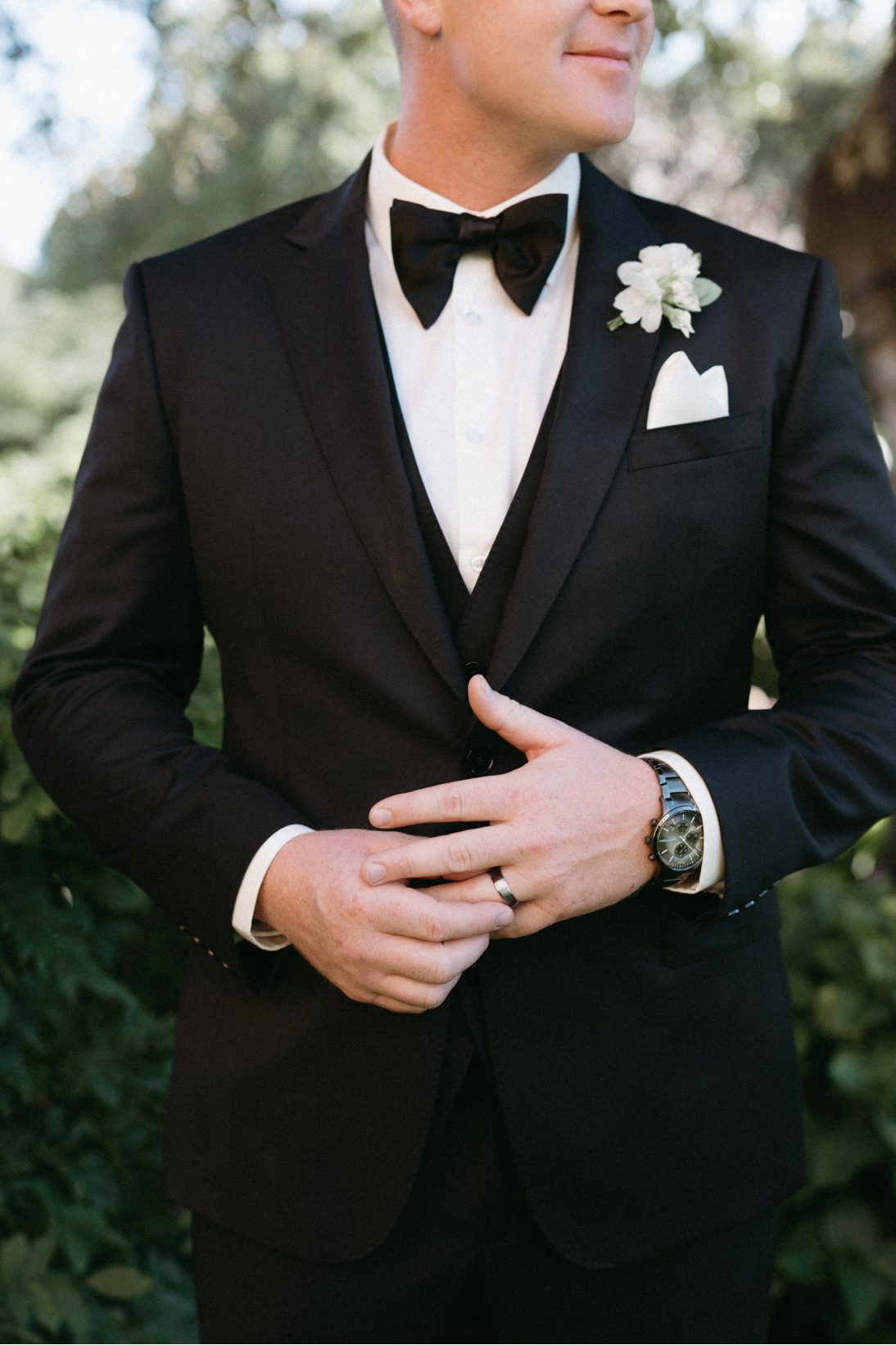 A snapshot of Tanner's wedding attire, a crisp black tux and classic white boutonniere.