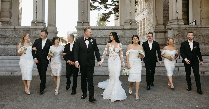 Stephanie and Tanner with their bridal party outside the Fairmont Empress hotel in Victoria