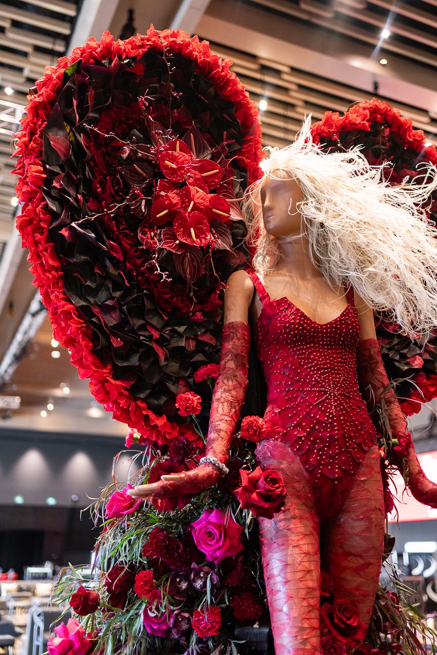 A close up of Beyonce, showing the details of her windswept hair and the details of the backpiece of her dress.