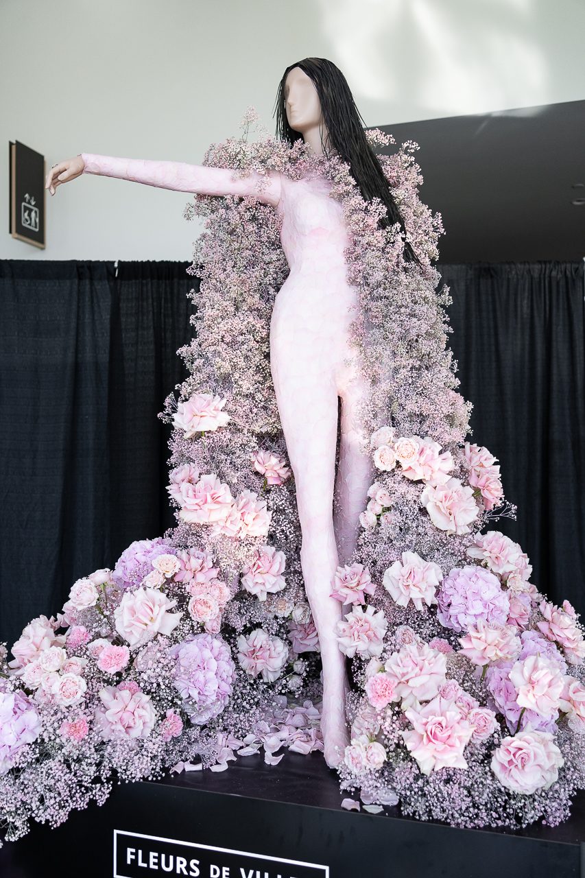 Very pretty and feminine floral mannequin of Kacey Musgraves, with oodles of pastel pink fluffy flowers.